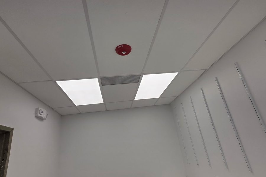 Finished room with acoustic ceiling and wall standards
